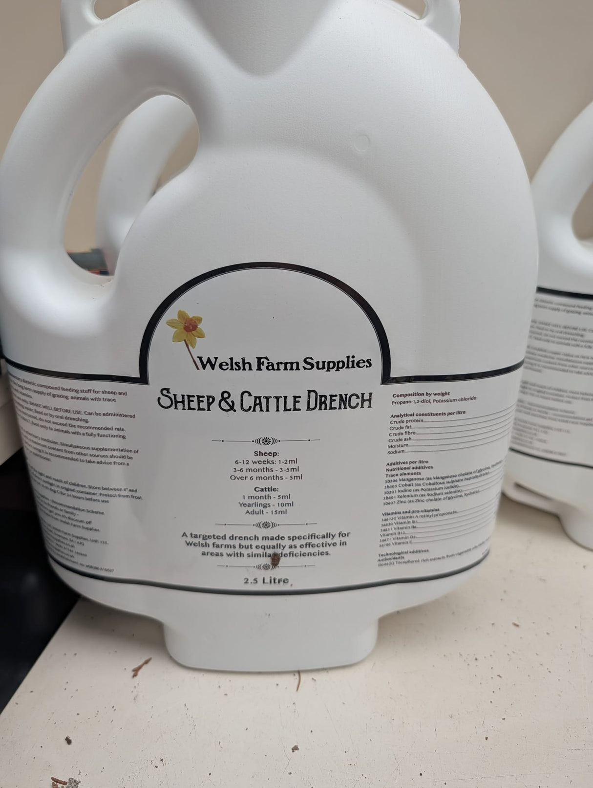 Welsh Farm Supplies Sheep & Cattle Drench bottles (2), white plastic, 2.5 L each, with yellow flower logo