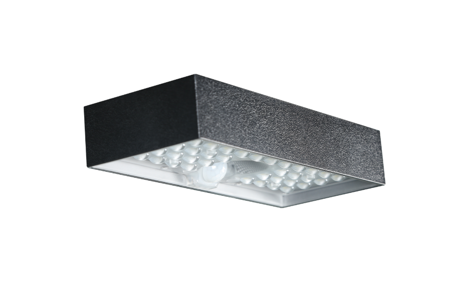 Solar brick light with black metal housing and LED array for outdoor security lighting