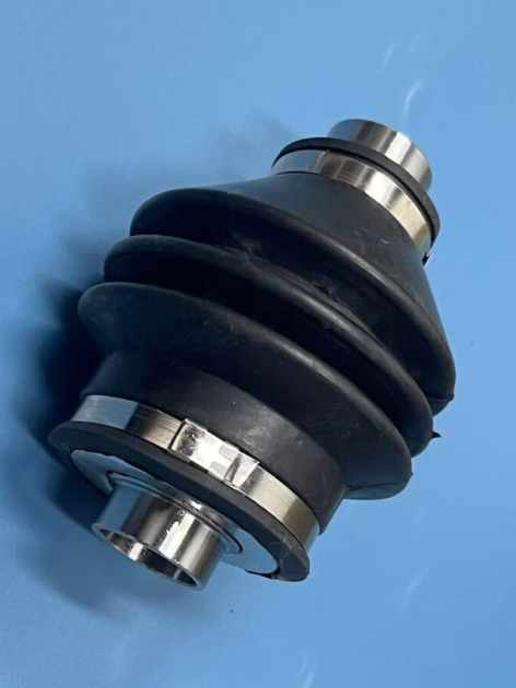 Rear joint yoke prop shaft with black rubber boot and metal clamps