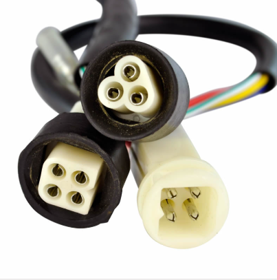 Performance CDI module harness for Yamaha YFM350 Warrior ATV; two black circular 4-pin plugs and a beige 4-pin connector.