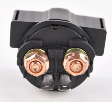 Starter solenoid with two copper terminals and black plastic housing.