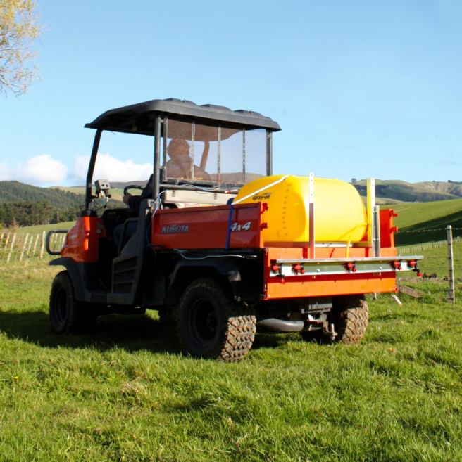 C-Dax MultiBoom ATV spray boom system mounted on an orange Kubota ATV with a yellow tank