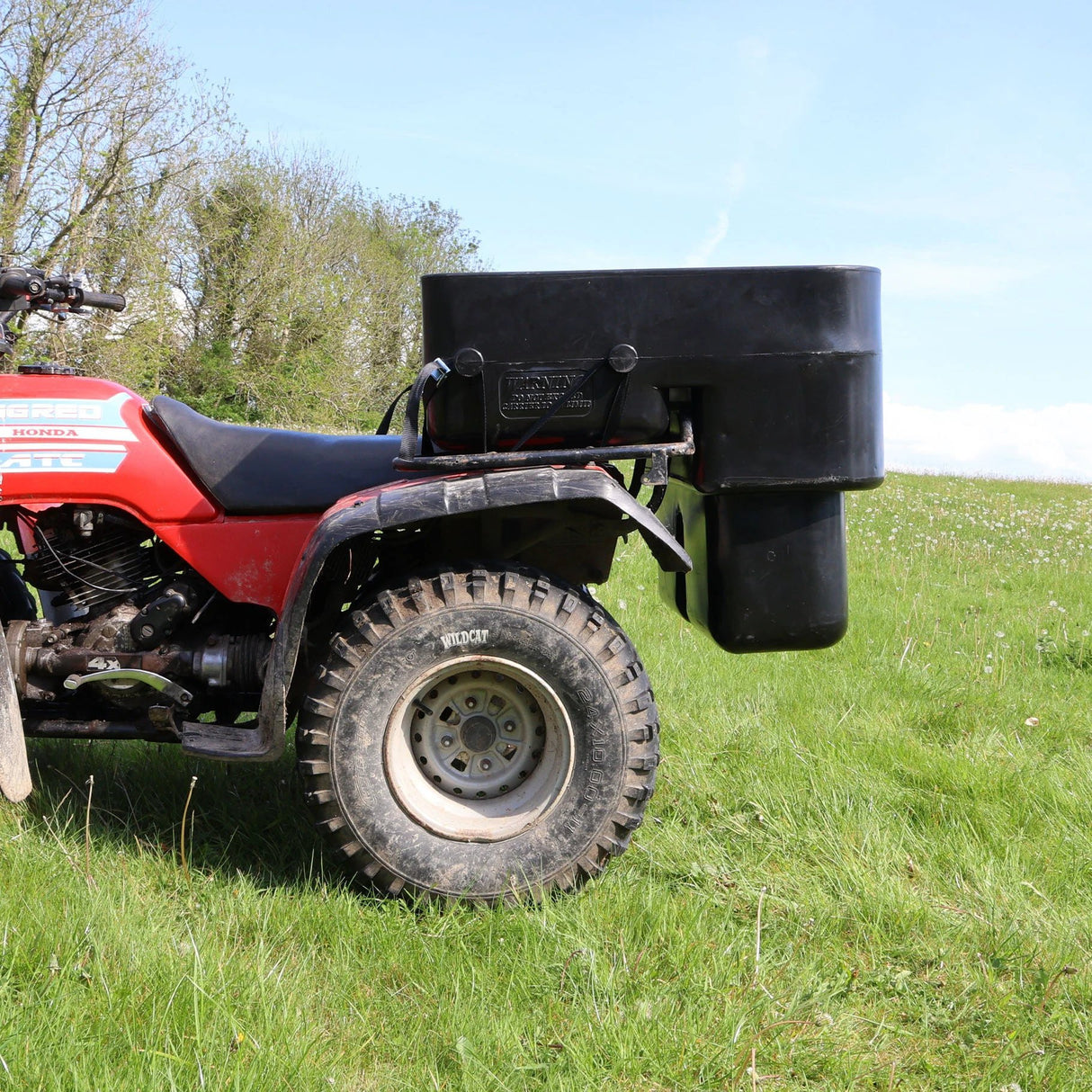 ATV storage box 250L deep carrier mounted on a red ATV, black heavy-duty universal-fit cargo box