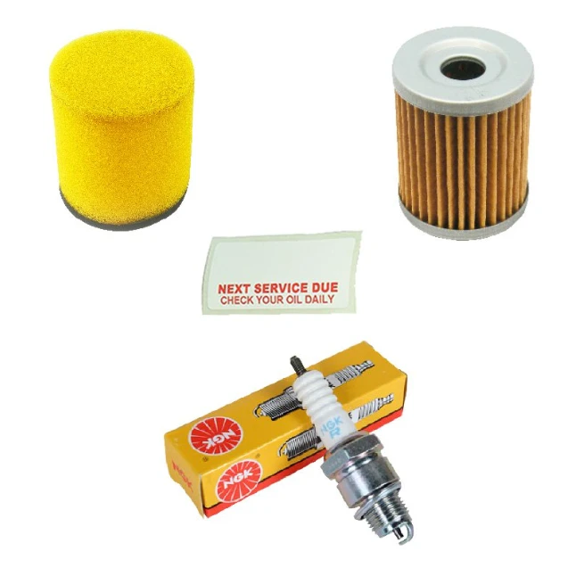 Suzuki LTF 250 Ozark ATV service kit: yellow foam filter, brown pleated air filter, NGK spark plug, reminder card