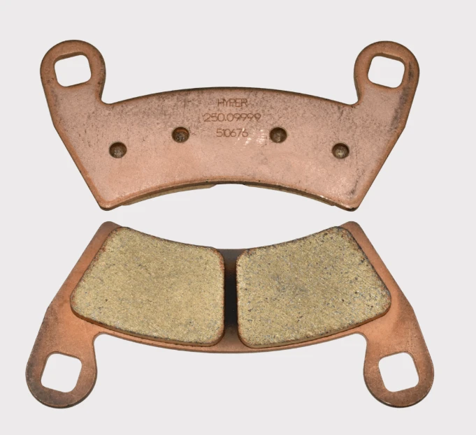 Front brake pad pair for Polaris Ranger by ATV City, copper backing plates with friction material