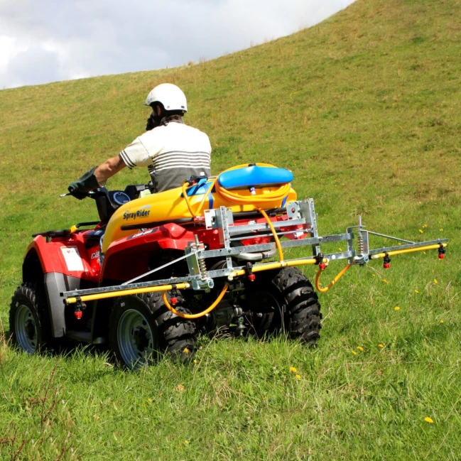 C-Dax ATV 3m Folding Sprayer Boom with Breakaway for ATVs/UTVs, six nozzles on a red ATV
