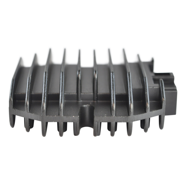 Regulator rectifier heat sink for ATV, gray plastic housing with cooling fins.