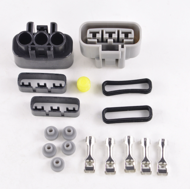 MOSFET regulator/rectifier kit for ATVs in black and gray with connector housings, seals, and crimp terminals