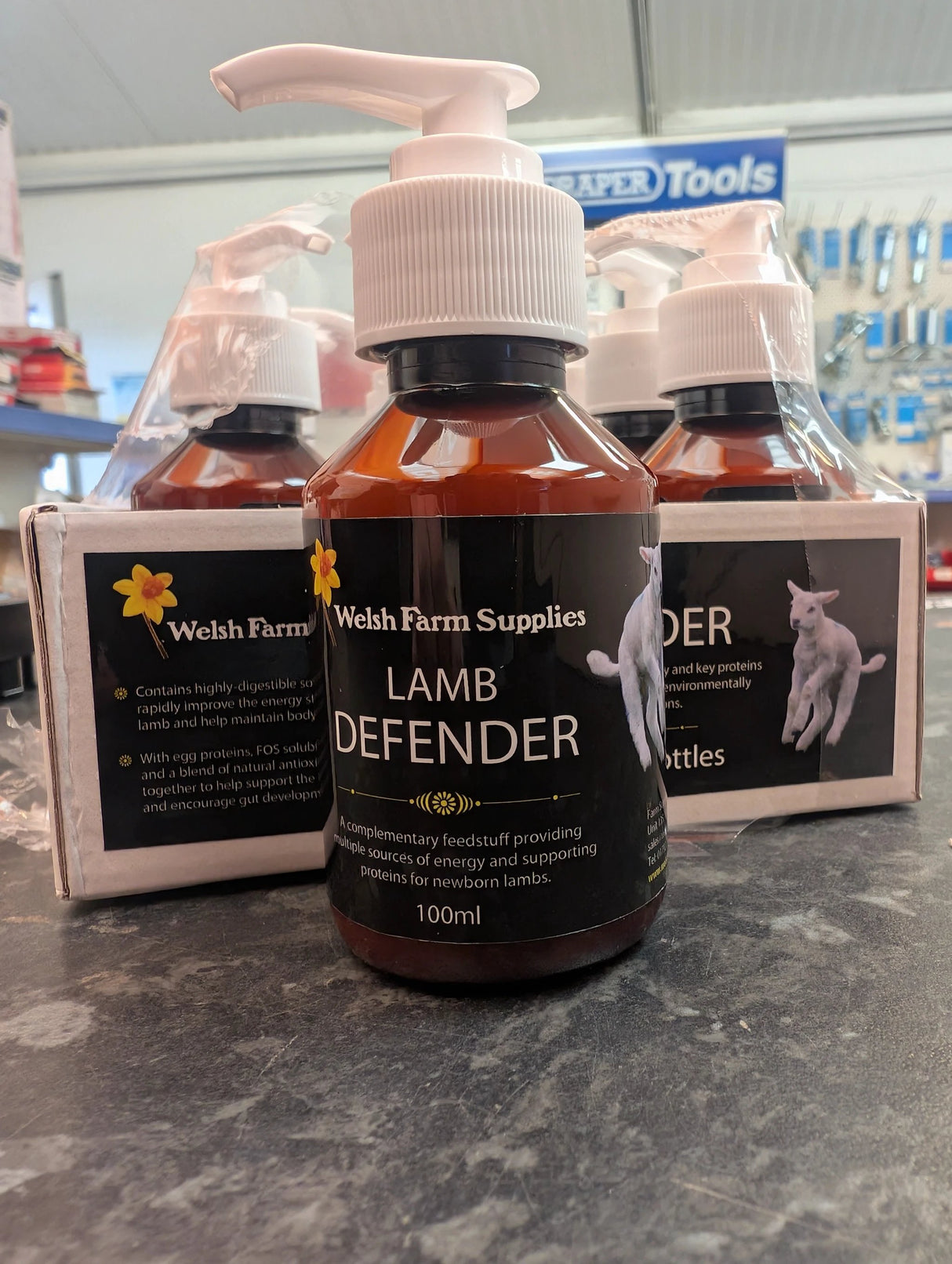 Welsh Farm Supplies Lamb Defender 100ml bottle with white pump, dark brown liquid for newborn lambs