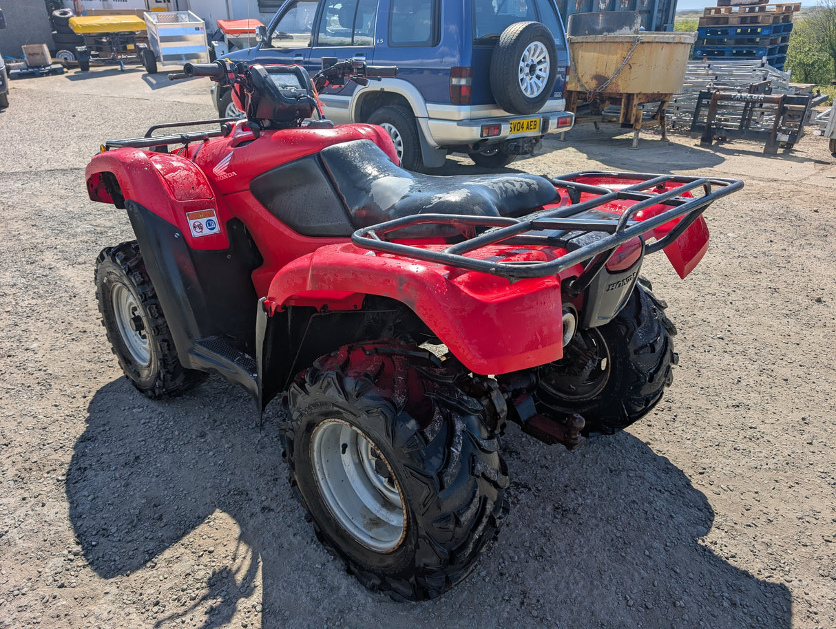 Honda red ATV TRX 500 with front and rear cargo racks