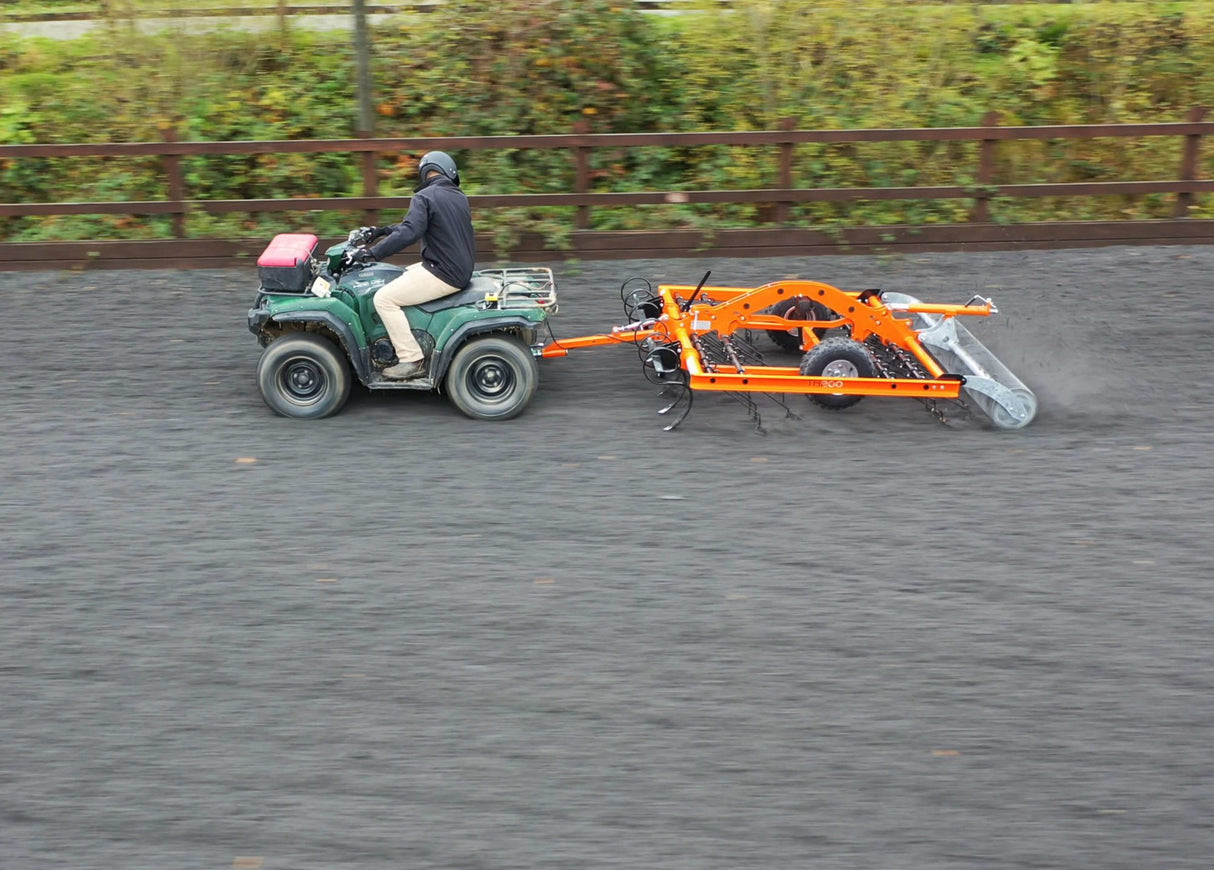 Chapman AH200 Arena Harrow attached to ATV, orange 2.0m S-tine harrow with rear roller