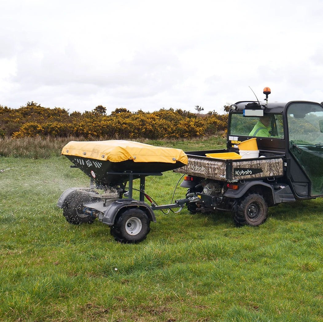 JFC Agri ATV fertiliser spreader on Kubota utility vehicle; yellow cover, manual control, 500kg hopper, 14m spread