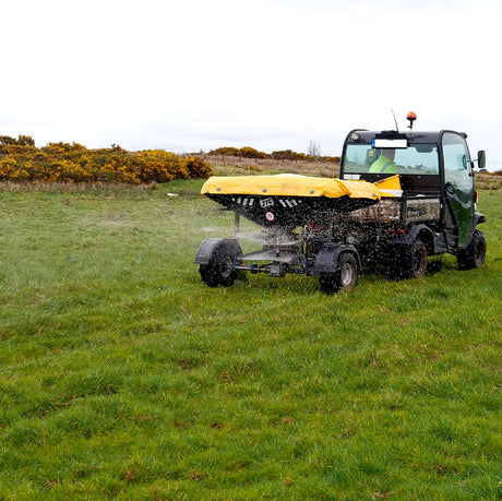 JFC Agri ATV fertiliser spreader with yellow cover, manual control