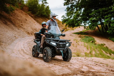 CFMOTO CForce 625 Touring Overland ATV with ABS in Granite Ridge, two riders on a rugged dirt trail