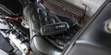 CTEK CT5 Powersport 12V battery charger on a black motorcycle seat.