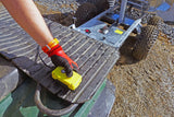 Chapman DT100 hydraulic dump trailer for ATV/UTV with rugged metal bed, large off-road tires, and yellow control box.