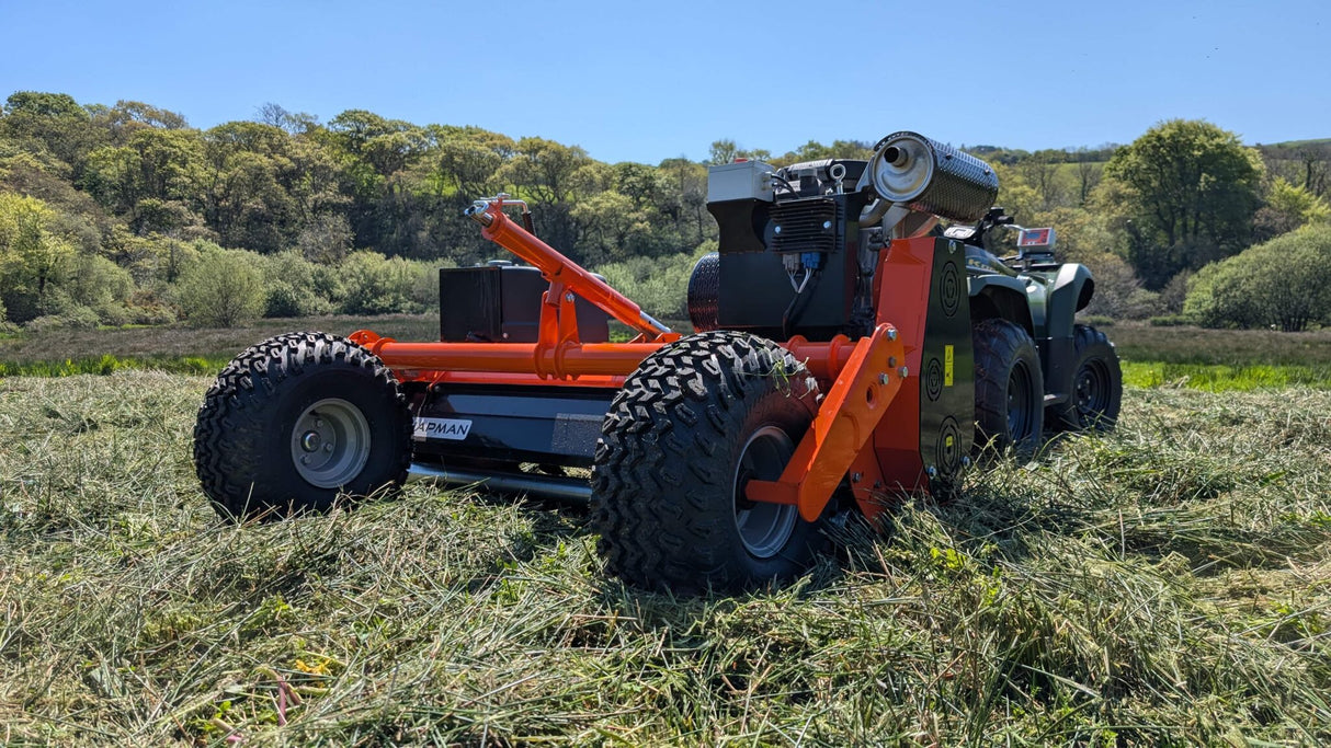 Chapman FM Pro ATV Flail Mower attachment in orange mounted on a utility ATV
