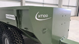 Chapman HT100 ATV trailer in NATO green with twin-pivot axle and visible Chapman branding.