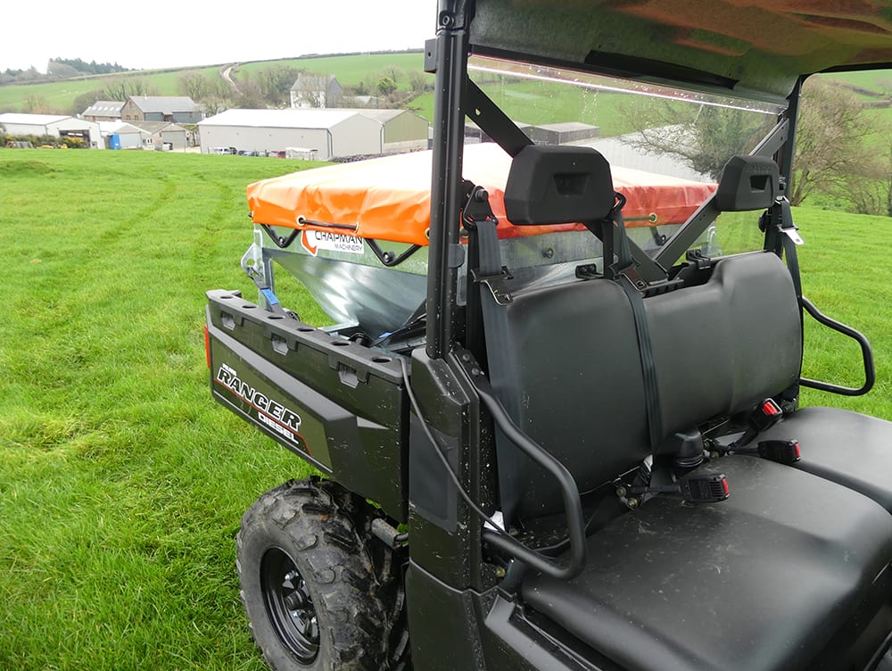 Chapman MF350 UTV-mounted stock feeder, 300L capacity, black with orange cover, electric drive, digital counter.