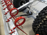 Chapman MG250 Arena Leveller, galvanised frame with red coil spring assemblies and large off-road tires.