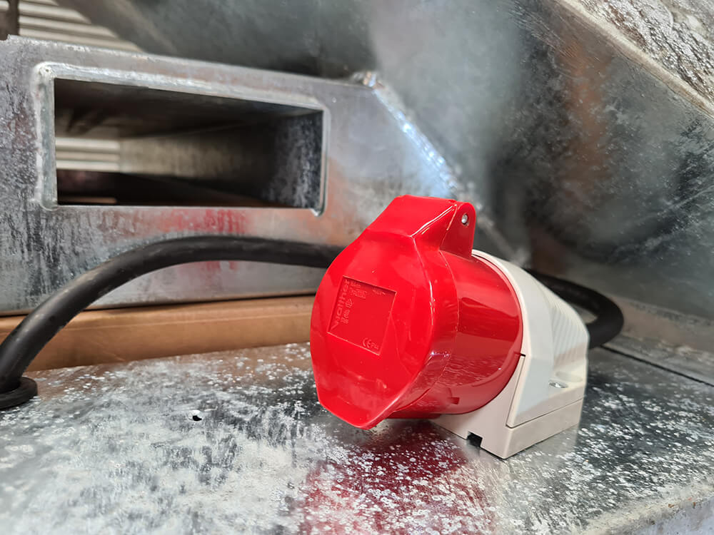 Chapman MGF350 Mounted Game Feeder component with red protective cap, white base, and black cord
