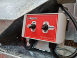 Chapman MGF350 mounted game feeder control box with red faceplate and two switches for open/close and spinner, 300L