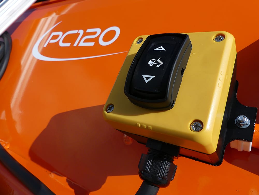 PC120 paddock cleaner yellow control box mounted on orange equipment