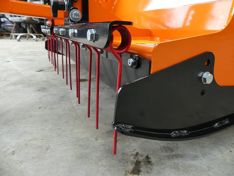 Chapman PC120 paddock cleaner with orange frame and red tines