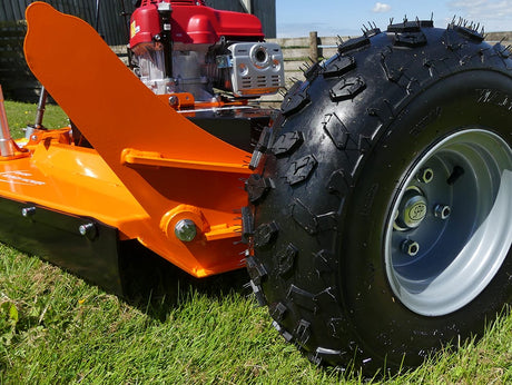 Chapman Rotary Paddock Topper for ATV, orange steel frame with Honda 13hp engine and rugged tire