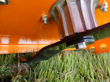 Chapman RM Series ATV Rotary Paddock Topper on orange frame; visible mounting hub bolt and curved black guard near grass.