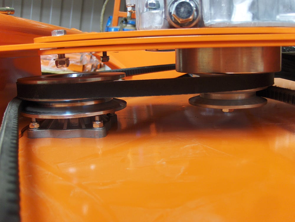 Chapman RM Series ATV Rotary Paddock Topper on orange deck with belt-driven pulleys