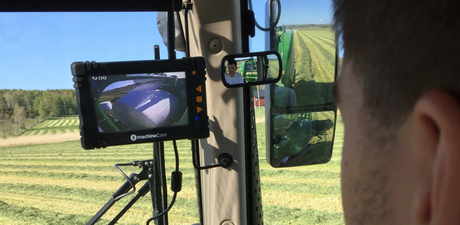 JFC Agri FarmCam HD Wireless Camera System with MachineCam display mounted in tractor cab showing field view.
