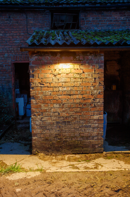 FC Agri Flare 900lm solar brick light 6W on a brick pillar, warm amber outdoor security lighting