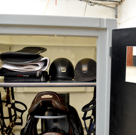 JFC Agri Equine Tack Locker, light grey lockable horse tack storage on wheels; interior shows saddles and helmets.