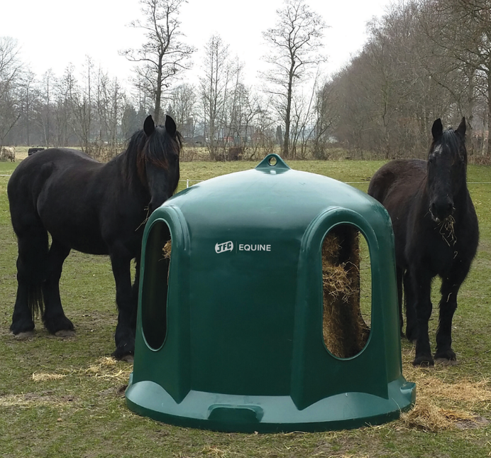 JFC Haybell Round Bale Cover Feeder 4-Port, green, no metal components; two horses nearby.