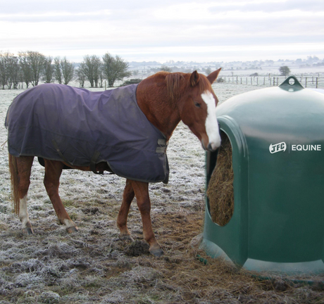 JFC Haybell Round Bale Cover Feeder, green JFC Equine bale feeder beside a horse