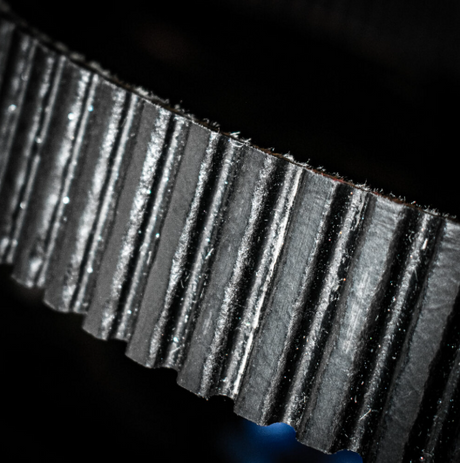 Gates G-Force Redline CVT drive belt close-up; black toothed belt