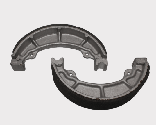 Brake shoe set MBS2307 by ATV City, two gray metal brake shoes with black friction lining.