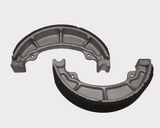 Brake shoe set MBS2307 by ATV City, two gray metal brake shoes with black friction lining.