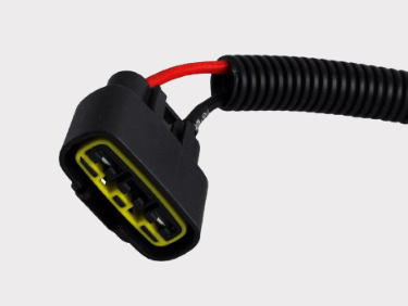 REVOLT voltage regulator connector by DGT Agri, black housing with yellow terminals and red wire.