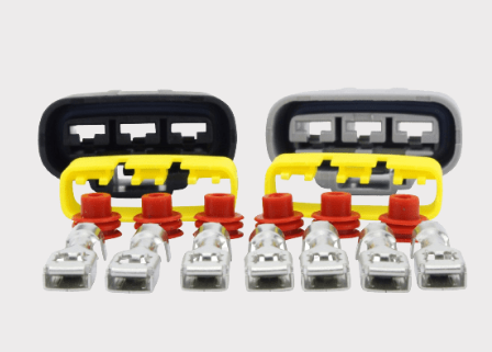 Regulator rectifier pair by DGT Agri for Kawasaki KAF400 Mule SX EFI, yellow and black housings with eight terminal studs.