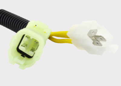 REVOLT voltage regulator/rectifier with lime-green housing and white 2-pin plug; two yellow wires.
