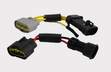 REVOLT regulator/rectifier for motorcycles; DGT Agri, dual harness connectors with black/gray plugs and yellow wiring.