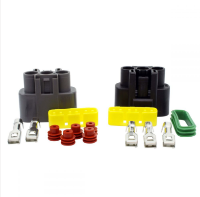 Series Regulator Rectifier kit with dual black connectors, yellow plugs, red seals, metal terminals, and a green clip