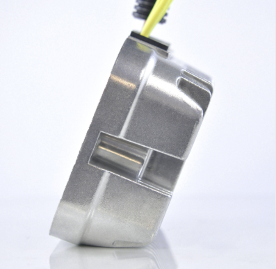 MOSFET regulator rectifier with metal housing and yellow wiring harness.