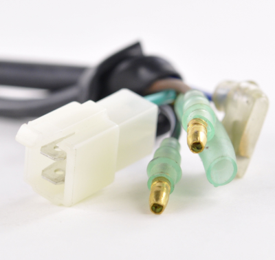 High performance CDI module for Suzuki LT160E/LTF160 Quadrunner ATV; white 2-pin connector with green bullet terminals.