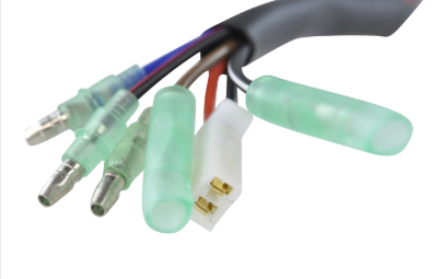 Performance CDI module wiring harness with green insulated bullet connectors and a white locking plug.