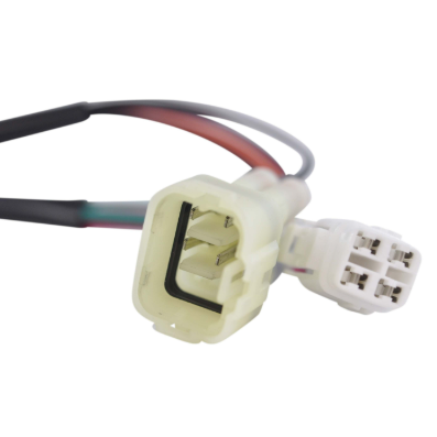 Performance CDI module connector for Yamaha YFZ350 Banshee ATV by DGT Agri, white plug with red and black wires.