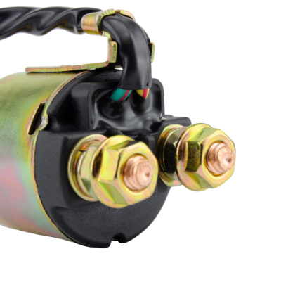 Starter solenoid with gold-tone terminal bolts and black housing; wiring harness visible