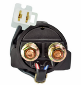 Starter relay solenoid with black plastic body, brass terminal posts and a white connector.